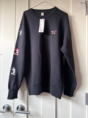 Uniqlo Disney Black Crewneck Sweatshirt with Mickey Mouse Graphics on Sleeve